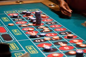 Live dealer revealing cards during a Speed Baccarat round with multi-camera angles visible